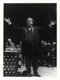 Historic Print (M): [William Jennings Bryan, full-length view with arms spread, standing next to flag drappe