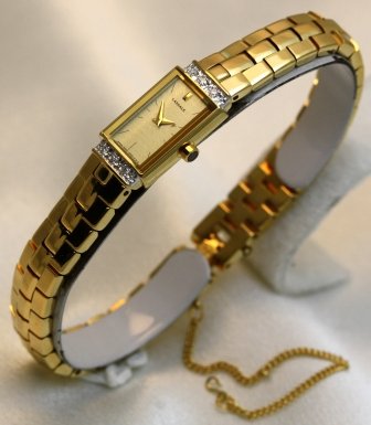 Lassale Watches- Seikos Top of the Line Sapphire Crystal 23K Gold Finish Diamonds and a Safety Chain Womens Watch