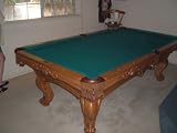 OLHAUSEN Brunswick 8 Ft. Pool Table-Custom-ordered, Handmade-8 Foot Regulation Table with Accufast Cushions. 1 1/2 inch Brazilian slate bed. Dona Marla Maple Finish with inlaid mother of pearl on rails. Comes with Leather cover, balls, 27 inch rack and cues.