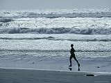 A Person Jogs Along the Beach Photographic Poster Print by David Boyer, 32x24
