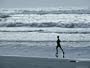 A Person Jogs Along the Beach National Geographic Collection Photographic Poster Print by David Boyer, 64x48