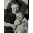 "For Conspicuous bravery in the presence of the enemy": this war's fifth Vic toria Cross goes to widow and baby daughter Carol of Lance Corporal Harry Nicholls, killed in Flanders ..... 1940 LIFE Magazine Picture, A0718