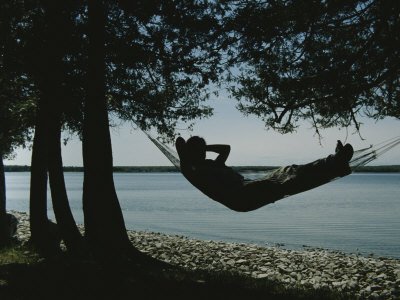 A Person Relaxes in a Hammock That Overlooks Lake Michigan Stretched Canvas Poster Print, 24x32