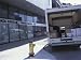 Back of Delivery Van Full of Packages on Street by Downtown Financial Services Building Photographic Poster Print, 16x12