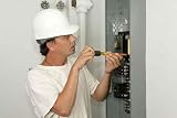Electrician Installing Breaker - 18W x 12H - Peel and Stick Wall Decal by Wallmonkeys