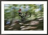 A Boy Flies Through the Air on His Mountain Bike Framed Photographic Poster Print by Roy Gumpel, 35x26