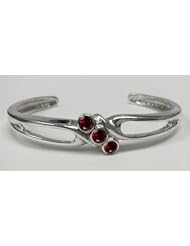A Large Sterling Silver 3 Stone Cuff Bracelet Accented with Genuine Faceted Garnet
