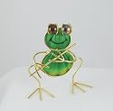 Frog and flute figurine with shell body and face