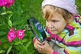 IMAGE OF Wallmonkeys Peel and Stick Wall Decals - Pretty Little Girl with Magnifying Glass Looks at Flower - 48