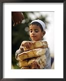 A Boy Carries Rusk as He Assists Others to Send a Consignment of Relief Supplies to Uri Photography Framed Art Poster Print, 18x22