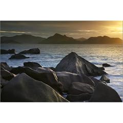 Poster 100 x 70 cm - "Granite rocks at edge of Anse Severe beach at sunset with Praslin in background." von Ruth Eastham & Max Paoli / Lonely Planet Images - auch in anderen Gr��en und als Leinwandbild erh�ltlich