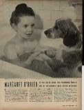 MARGARET O'BRIEN - At the age of seven, this personable child is one of Hollywood's most gifted actresses. Bubble baths are a special treat for Margaret O'Brien. She sometimes shares the bathtub with Maggie, a dappled Spaniel who is her constant companion. ..... 1944 LIFE Magazine Picture, A4463A.
