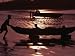 Man Pushing Dug-Out Canoe to Water's Edge with Two Children on Board, Esmeraldas, Ecu...