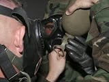 A Marine Assists Another Marine in Helping Him Fit His Gas Mask's Drinking Tube into His Canteen Photographic Poster Print by Stocktrek Images, 16x12