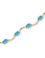 14kt Yellow Gold Oval Blue Topaz Bracelet.