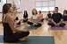 Teacher Guides Student in Yoga Class - 48