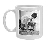 Photo Mug of LADY POLISHES A TABLE from Mary Evans