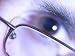 Close-Up of Glaring Eye Wearing Modern Eyeglasses Photographic Poster Print, 16x12