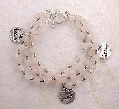 Click here to buy Three Strand Rose Quartz LOVE Charm Sterling Silver Bracelet.