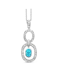 Trio Oval Diamond Pendant In 18K White Gold With A 1.10 ct. Genuine Blue Topaz Center Stone.