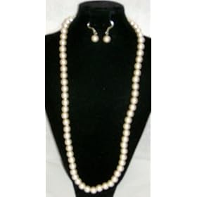 Click here to buy One Strand Faux Ivory Pearls Medium Chain on Silver Necklace Earrings for Women and Teens by Gita.
