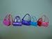 A Set of 7 Barbie Purses Various Colors and Styles.