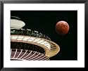 The Full Moon Turns Red and Orange as It Passes the Space Needle Framed Art Poster Print, 31x25