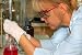 Chemist with Test Tube - 24W x 16H - Peel and Stick Wall Decal by Wallmonkeys