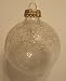 Package containing 3 Clear glass ball Ornaments with Simulated Snow and glitter on th...