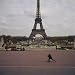 Side Profile of a Boy Riding a Push Scooter, Eiffel Tower, Paris, France Photographic Poster Print, 24x24