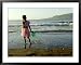 A Girl Walks on the Beach in Jacmel, Haiti, in This February 5, 2001 Framed Art Poster Print by Lynne Sladky, 39x31