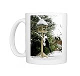 Photo Mugs of Cat - black a white cat climbing up a bird feeding table in snow from Ardea Wildlife Pets