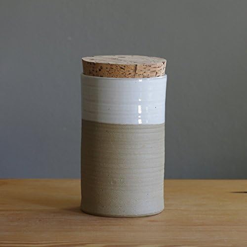 white and sand colored stoneware pottery jar