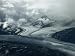 Branches of a Glacier Join Together Below Cloud-Covered Peaks Photographic Poster Pri...