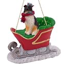 SHETLAND Sheep Dog SHELTIE Tri-color rides on a SLEIGH Tri-Color Christmas Ornament SLD20B