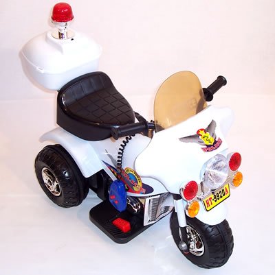 Childrens Toyshop  Toys : Ride on kids toy battery powered rechargeable junior police trike - White