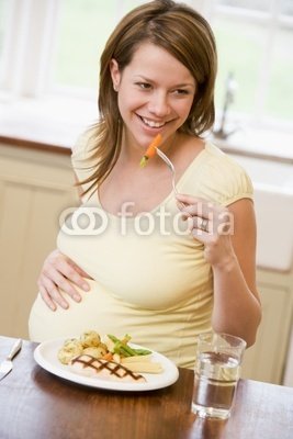 Wallmonkeys Peel and Stick Wall Decals - Pregnant Woman in Kitchen Eating Chicken and Vegetables Smiling - 60