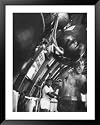 Boxer Rocky Marciano, Working Out Punching Bag, at Training Camp, Before Fight with Archie Moore Framed Art Poster Print by Grey Villet, 33x41