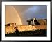 An Afghan Man Walks Past Destroyed Buildings Occupied by Refugees after a Heavy Rain Afghanistan Framed Art Poster Print, 49x39