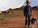 Boy with Dog Walking Past Solar Energy Dishes, New South Wales, Australia People Photographic Poster Print by Oliver Strewe, 12x9