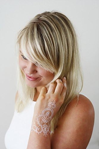 White henna style hand temporary tattoo