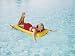 Happy Woman Sun on Bathing Inflatable Pool Raft Photographic Poster Print by Dennis Hallinan, 24x32