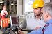 Wallmonkeys Peel and Stick Wall Decals - Supervisor Talking to Engineer in Warehouse - Removable Graphic