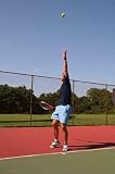 Young Man Serving Tennis Ball - 24