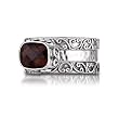 Sterling Silver This beautiful sterling silver stacking ring by Sara Blaine features a faceted smokey topaz and scroll detailing for a one of a kind look.