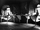 Ballerinas at Barre Against Round Windows During Rehearsal For 