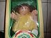 Cabbage Patch Kids 1985 Doll with blond hair, yellow sweater and one tooth sticking out