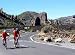 Cyclists Moving toward the Peak of Mt Teide - 24"W x 18"H - Peel and Stick Wall Decal by Wallmonkeys
