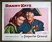 ORIGINAL LOBBY CARD: DG15 Inspector General DANNY KAYE Orig '50 Lobby Card.  Here’s a terrific PORTRAIT lobby card from the original release of THE INSPECTOR GENERAL featuring a great image of DANNY KAYE and BARBARA BATES.    Lobby card is in near MINT  to excellent plus condition. No pinholes, no stains, no tears, two small pieces of brown paper masking on the back.       A lobby card is an 11 x 14 inch placard advertising a movie. They were displayed in the theatre lobby to entice moviegoers to go to the box office and buy a ticket.