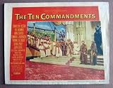 DK43 10 Commandments CHARLTON HESTON/BRYNNER Lobby Card.  Here’s a terrific lobby card from the original release of the Cecil B. DeMille masterpiece THE TEN COMMANDMENTS featuring a great image of CHARLTON HESTON and YUL BRYNNER.    Lobby card is in VERY GOOD- condition. Some pinholes, no stains, two one-half inch edge tears o the lower border and some creasing on the same border.       A lobby card is an 11 x 14 inch placard advertising a movie. They were displayed in the theatre lobby to entice moviegoers to go to the box office and buy a ticket.